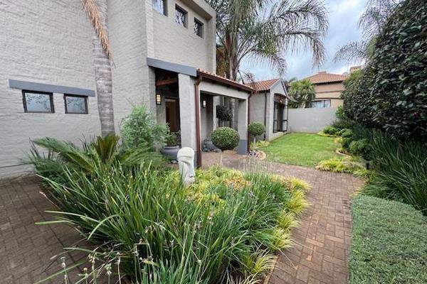 This elegant family home offers a welcoming entrance hall that leads to a well-appointed kitchen, ideal for preparing family meals. ...