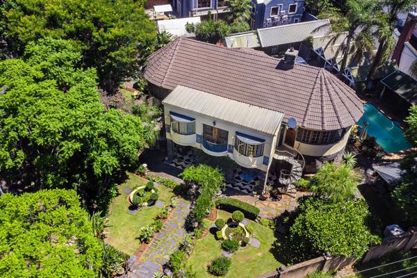 Step into a piece of history with this enchanting rondavel-style double-storey home ...