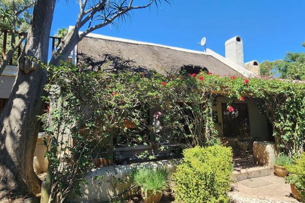 Exclusive Mandate: This charming 4-bedroom, 2.5-bathroom cottage is packed with ...