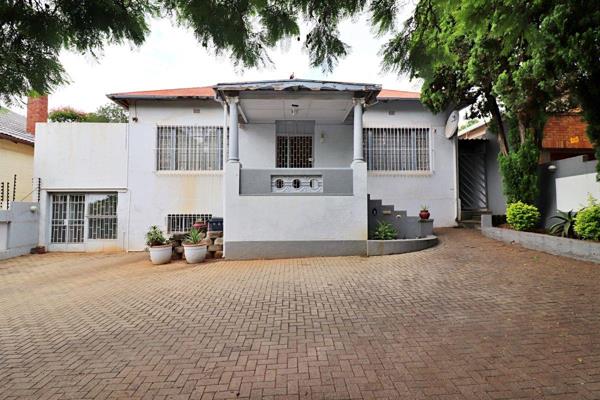 This charming 3-bedroom, 2-bathroom mid-century modern home is nestled in the heart of ...