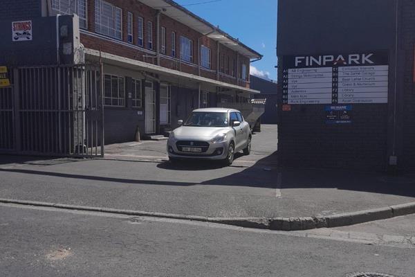 Light industrial unit with gated pedestrian doorway to reception and twin roller shutter doors for entrance to and exit from the ...