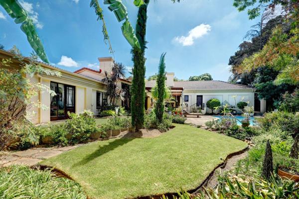 Nestled in a tranquil, tree-filled garden, this spacious family home offers a serene ...