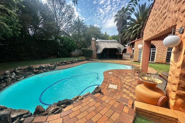 Stunning 4-Bedroom family home featuring a pool, entertainment area and excellent ...