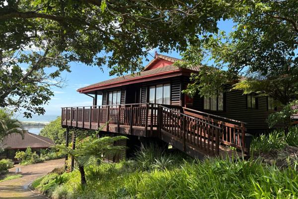 Authority To Sell: Discover the potential of this two bedroom, two bathroom log townhouse set along the tranquil Umkobi Lagoon ...