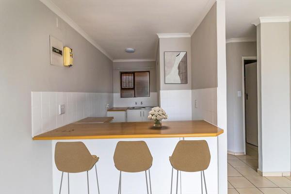 This newly renovated 2-bedroom apartment features fully tiled floors and an open-plan kitchen with space for a fridge, a washing ...