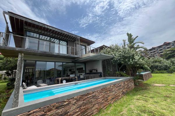 This stunning 4-bedroom townhouse in Ocean Edge, Zimbali, offers a perfect blend of luxury, comfort, and breathtaking views of the ...