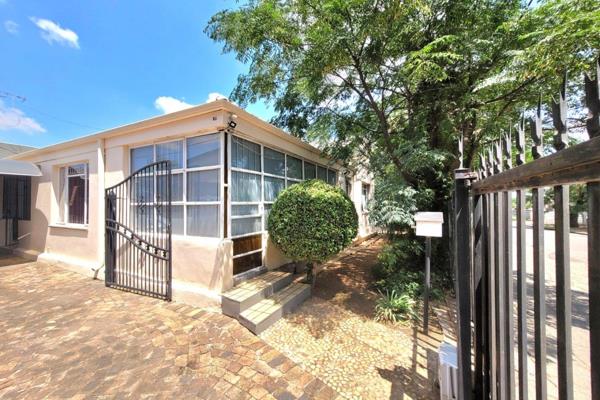 Step through the enclosed patio into a generous dining room that leads into a bright family living area, complete with a sunroom that ...