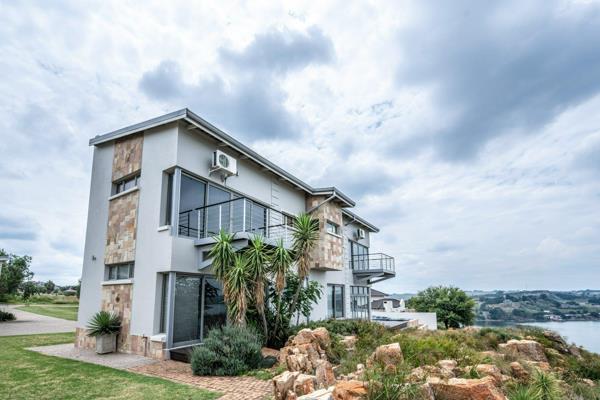 Stunning designer  home on the ridge in Aquavista Mountain Estate, offering breathtaking views of Bronkhorstspruit Dam. Designed to ...