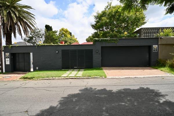 Access this gem via a double garage or through garden entrance crossing the manicured front courtyard to enter by french doors banked ...