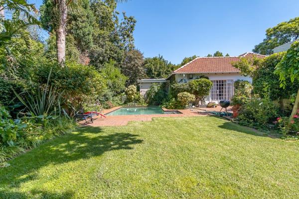 This beautiful property offers a spacious main house and two separate income-generating cottages, all set within a lush ...