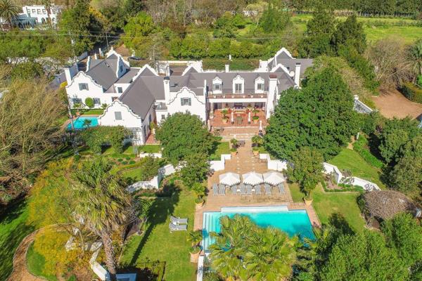 EXCLUSIVE SOLE MANDATE:  This highly respected Franschhoek Guest House with its grandiose appeal is perfectly positioned in the heart ...