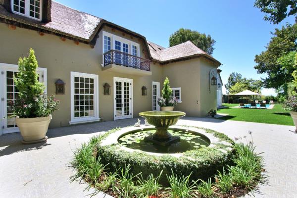 Nestled amidst lush, manicured gardens and majestic mature trees, this exquisite French villa epitomizes elegance and luxury. With ...