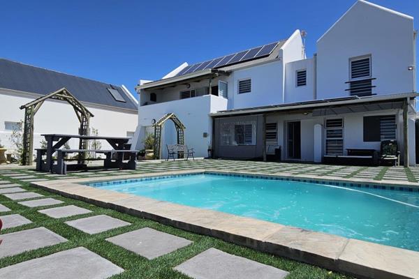 This beautiful three-bedroom home is perfectly situated in the sought-after Lampiesbaai ...