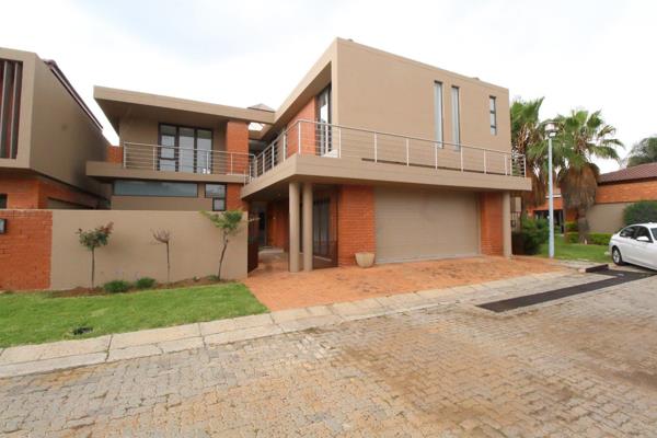 A large modern home in a secure complex.

Modern finishes, spacious layout,.

The home features a lounge and dining area ...