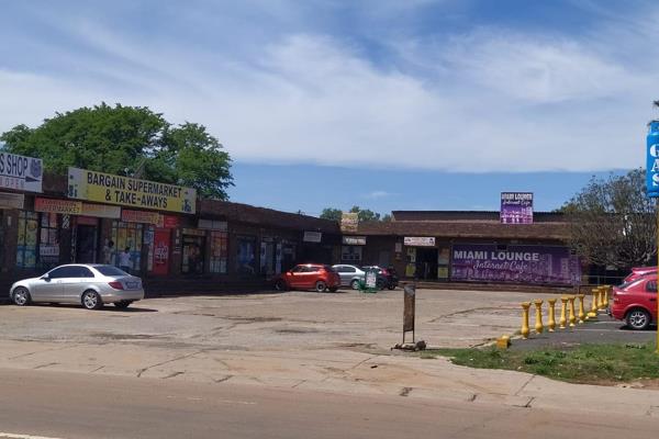 This expansive commercial property features established tenants and offers significant potential for both commercial and residential ...