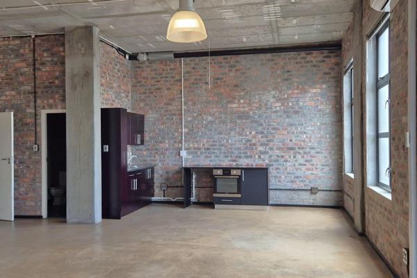 Airy and bright boutique office with a kitchenette and tall windows now available in ...