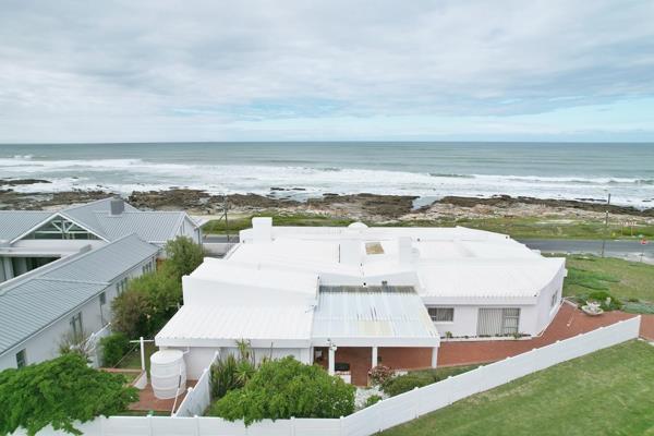 Exclusive Mandate - Experience the epitome of coastal living in this grand Struisbaai ...