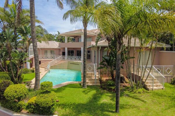 Set in a tranquil and private road in Umhlanga, this exquisite family home offers a harmonious blend of modern living and serene ...