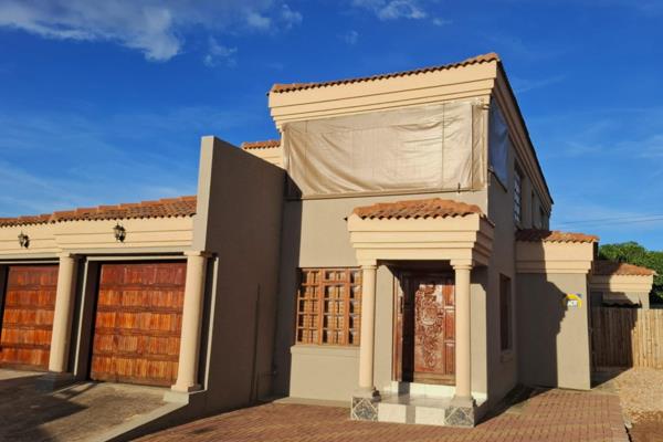 This charming home offers a practical and efficient layout, featuring a functional kitchen, a dedicated laundry room, and a cozy dining ...