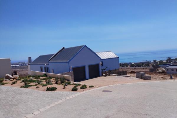 Panoramic Coastal Majesty: Your Off-Grid Sanctuary. 

Perched high above the stunning St. Helena Bay coastline, this three-bedroom ...