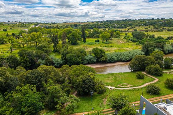 Tucked away in an exclusive, private setting along the river, this 4-bedroom, 3.5-bathroom home is a haven of tranquility and natural beauty. Boasting three lush green belts, it offers an unparalleled sense of seclusion—perfect for those who value privacy and breathtaking ...