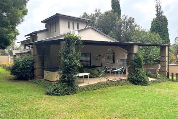 Entrance hall, open-plan dining area and lounge (custom curtains included in the sale) leading directly to the patio.
Study/Office and ...