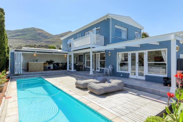 This wonderful property offers the coastal living experience with breathtaking views of Noordhoek Beach, Chapman&#39;s Peak, and a ...