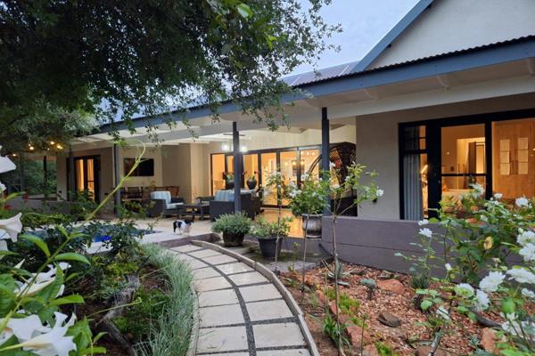 This stunning home offers 365 square meters under roof, blending modern design with bushveld living. The property features three ...