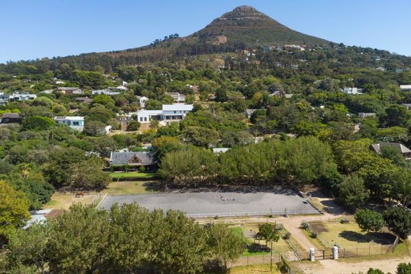 Nestled in the heart of Hout Bay&#39;s scenic valley, this rustic dual dwelling equestrian property offers a rare blend of tranquility ...