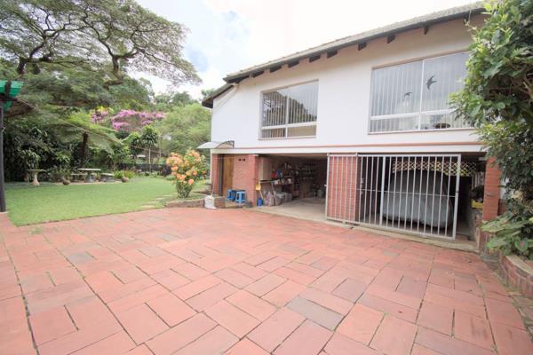 Pedestrian gate

Remote control gate
Paved driveway
Double garage
Carport
Front patio leads to lounge
Front garden
Well maintained ...