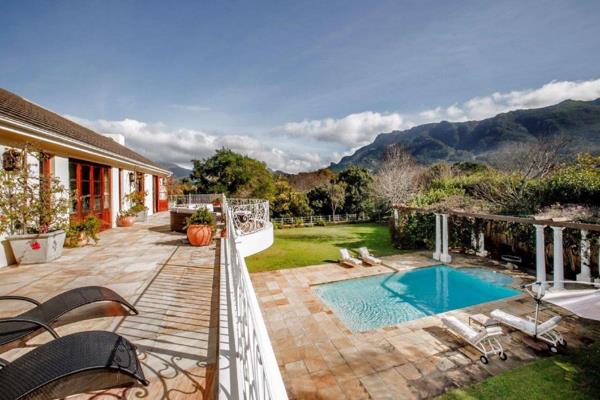 This stylish family home is situated in prestigious Constantia Valley with stunning mountain views. 

Modern with Palatial reception ...