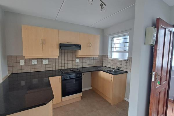 Contemporary apartment in a secure, well maintained complex.  Enjoy open plan living ...