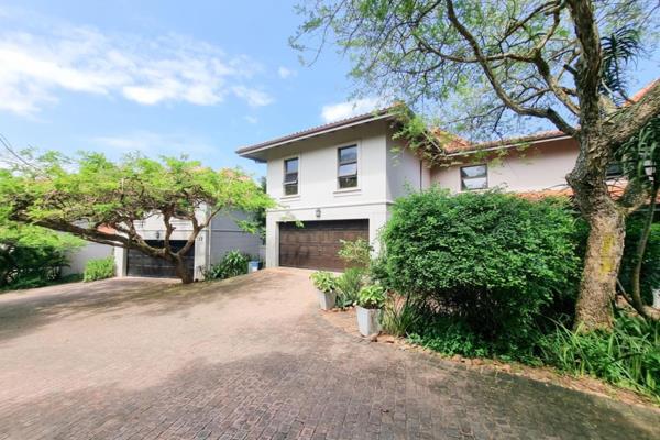 Tucked away in the lush coastal paradise of Zimbali Estate, this elegant four-bedroom, three-bathroom townhouse offers a seamless blend ...