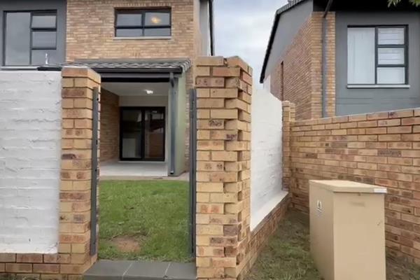 This is a stunning 3-bedroom, 2.5-bath residence offers a modern open-plan kitchen ...