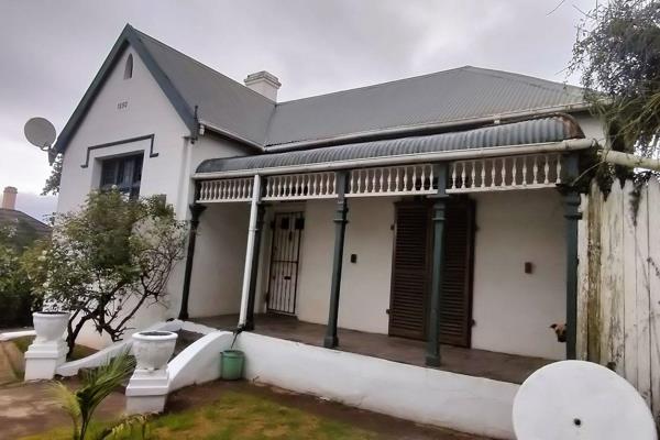 Discover the charm and character of this majestic Victorian home, built in 1890, waiting ...