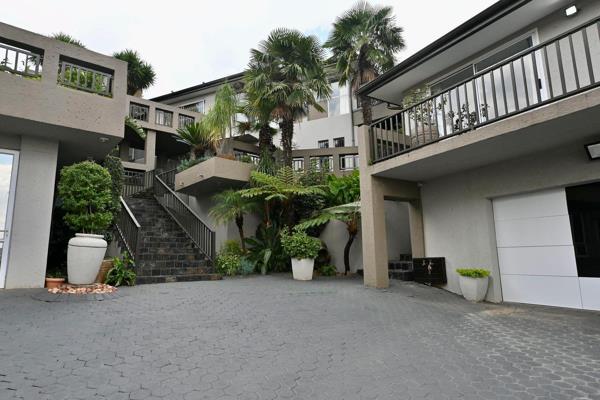 The double-volume entrance sets the tone for this extraordinary home, leading you into the heart of the property. The grand kitchen is ...