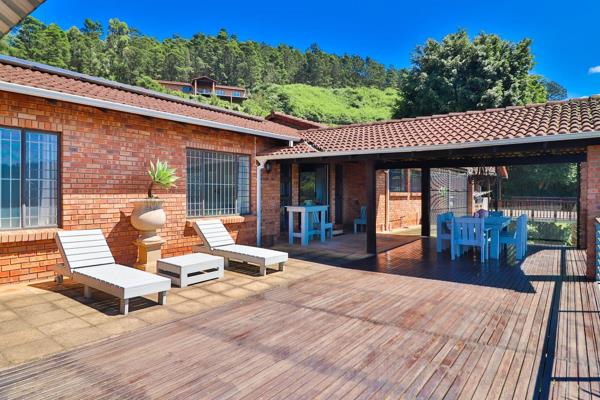 This most stylish townhouse features panoramic views from a verandah and large wooden deck which also incorporates  a built in braai ...