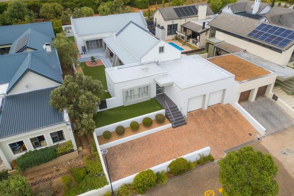 Experience the pinnacle of modern living in this immaculate 4-bedroom, 3.5-bathroom home nestled within the sought-after Schonenberg ...