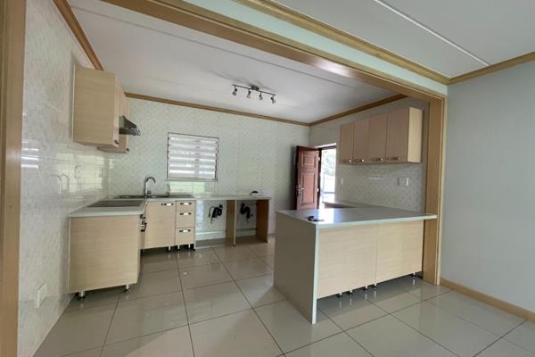 This ground  apartment features 3 bedrooms, 2 bathrooms, an open-plan kitchen with plenty of cabinet space, and a lounge that leads to ...