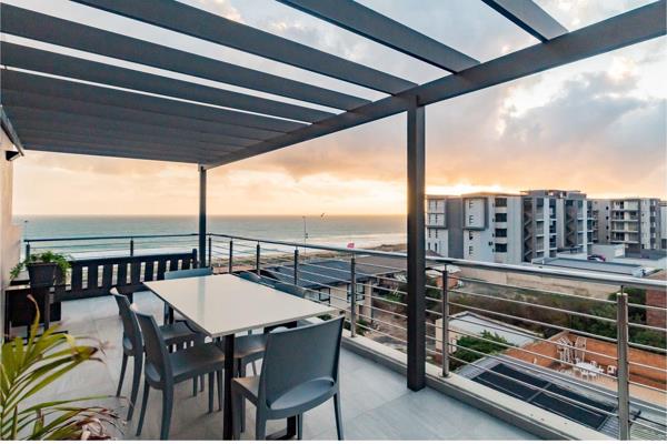 Step into this modern two-bedroom penthouse.  Ideal for kite surfers and ocean lovers. A ...