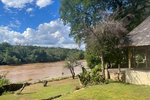 Nestled along the serene banks of the Olifants River, this exceptional 21-hectare ...