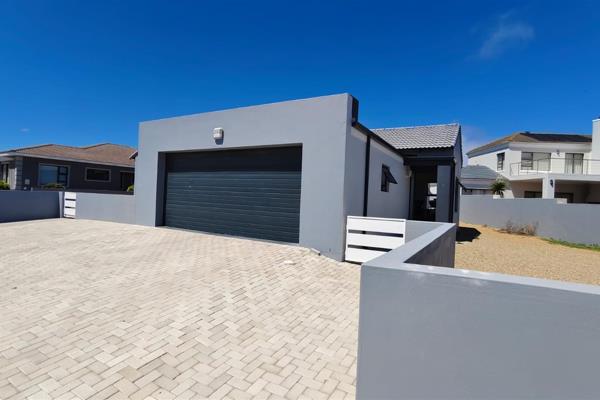 3 Bedroom house for sale in Country Club, Langebaan 

The open-plan kitchen boasts modern amenities, including an oven, hob, and a ...