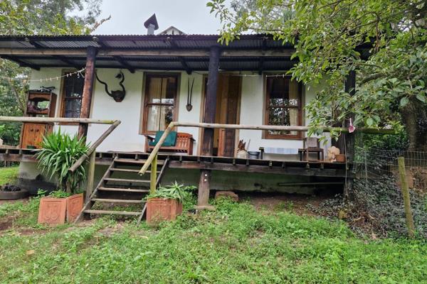 Tucked away on a peaceful shared property and embraced by the beauty of surrounding mountains, this delightful home offers a tranquil ...