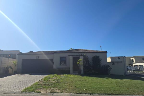 This modern home comprises of three bedrooms with built in cupboards, laminated flooring and double garage.  The main bedroom has a main ensuite and air conditioner.

The open plan kitchen, dining and lounge leads to a spacious backyard and braai area.

It is conveniently ...