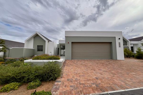 This stunning home blends modern style with everyday comfort in all the right ways. From the moment you step into the wind-sheltered ...