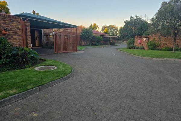 This townhouse offers open tiled open plan living areas with cherry wood kitchen offering plenty cupboard space. 

Patio doors leading ...