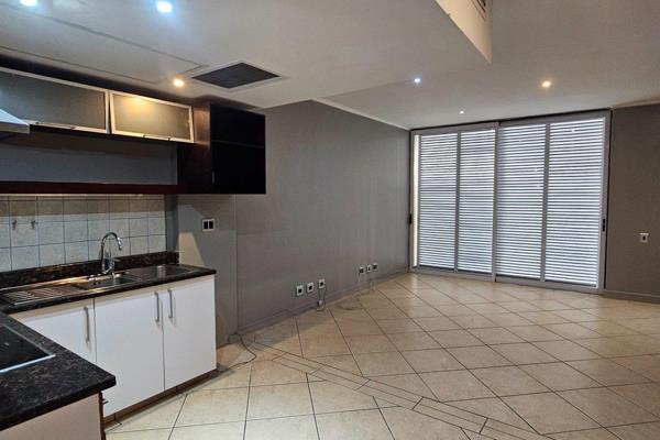 This modern apartment strikes the perfect balance between compact design and comfortable living.

The open-plan living area flows ...