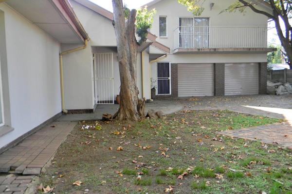 This spacious family home offers a versatile living space with large, sunny open-plan living areas, a dining room, family room, and ...