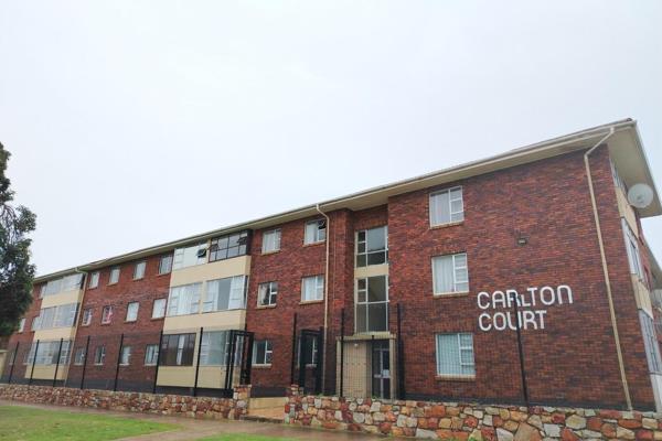 Spacious apartment featuring a large bedroom with parquet flooring, neat tiled bathroom with plumbing in place for a washing ...