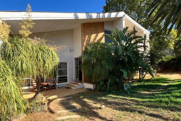 This home offers ample space for a growing family, featuring multiple open plan living areas including a lounge, dining room, and ...